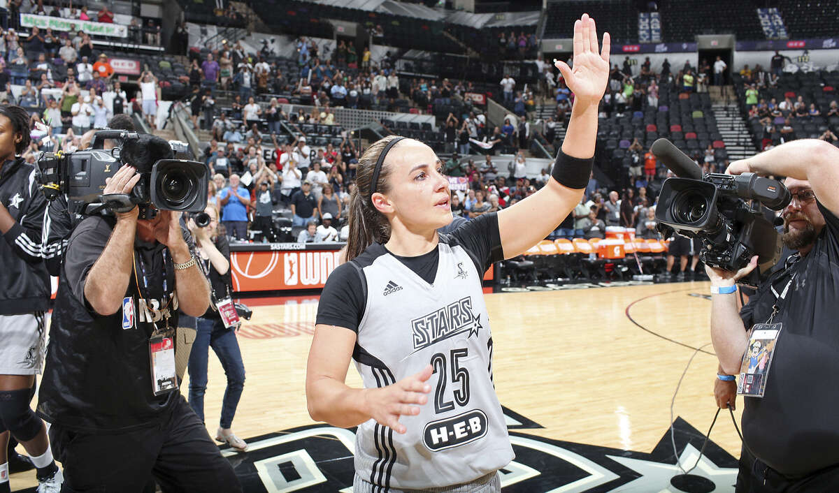 San Antonio Stars' Becky Hammon waves to fans after the game with the Minnesota Lynx Saturday Aug. 23, 2014 at the AT&T Center. The Lynx won 94-89. Hammon, who is retiring, will become the first woman to serve as a full-time NBA assistant coach with the Spurs.