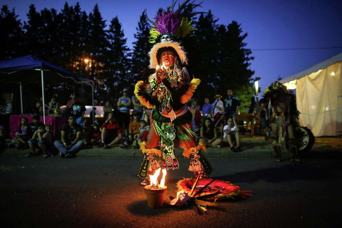 Aztec dancers from the group Tlokenahuake perform during the first weekend of the Evergreen State Fair in Monroe. The annual fair continues through September 1. Photographed on Saturday, August 23, 2014.