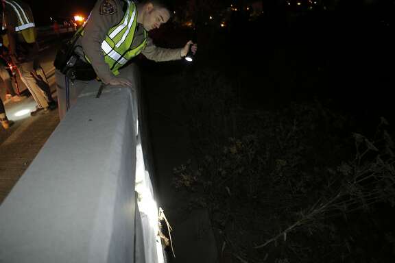 A CHP officer checks the offramp from Highway 37 to Sonoma Blvd. that was damaged as a strong earthquake hit the San Francisco Bay Area centered near American Canyon, Calif., on Sunday, August 24, 2014.