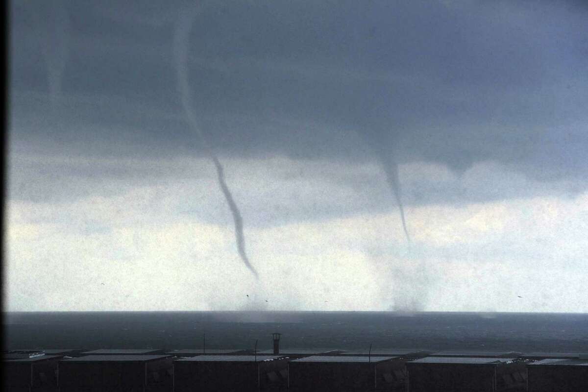Tornadoes are approaching the costal city of Genoa, in Northern Italy, Tuesday, Aug 19, 2014. Tornadoes and thunderstorms hit Genoa and the Liguria region coast Tuesday, causing damages to seaside cabins and floods but no victims.