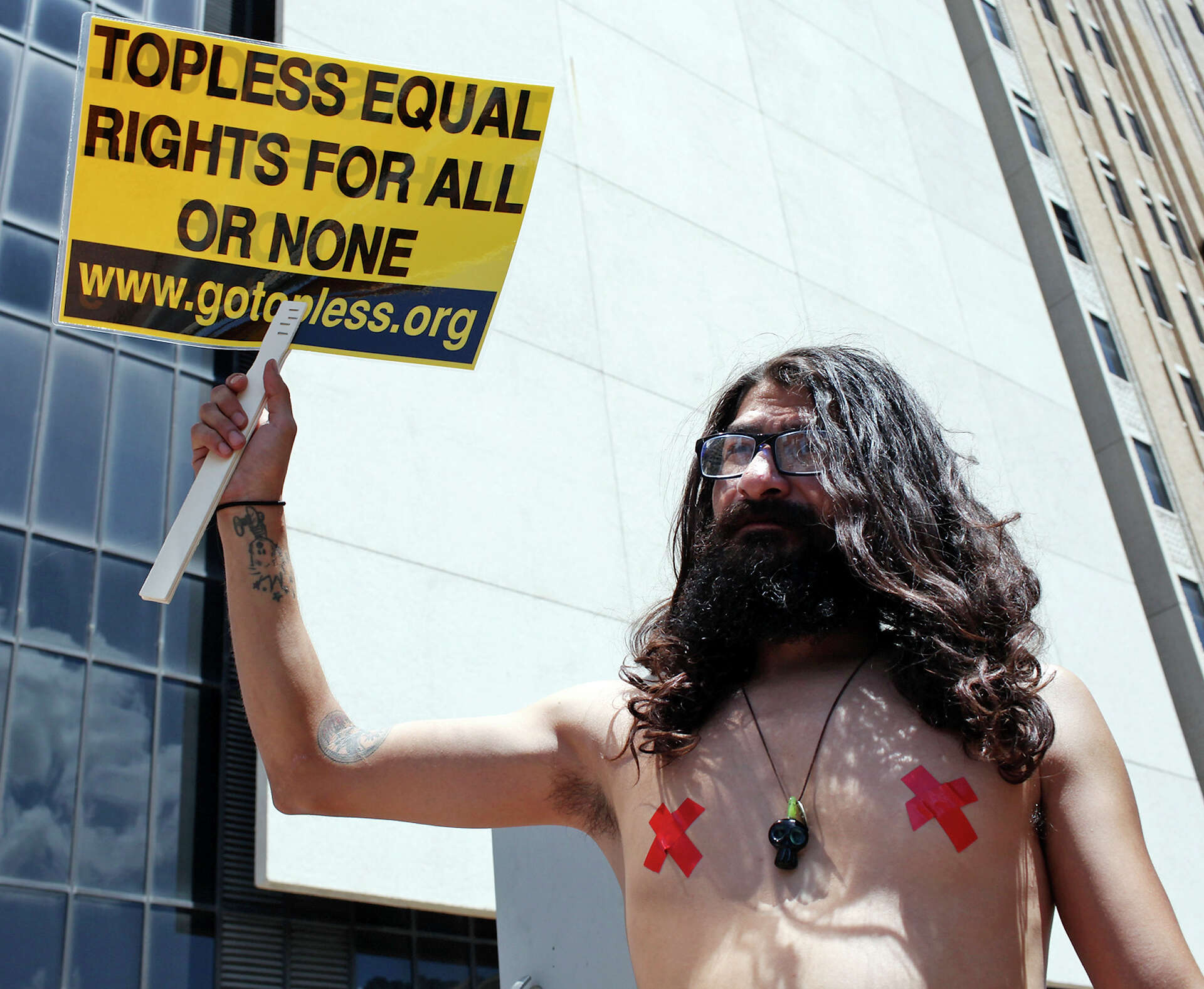 Almost topless women protest for right to bare it all