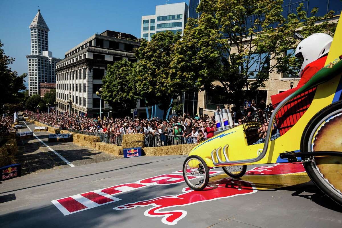 Team QFC begins their long descent down the steep grade of Yesler Way - with jumps and hard turns included - at the Red Bull Soapbox Race Sunday, August 24, 2014, in downtown Seattle, Washington. The rickety vehicles reached speeds of 40 miles per hour, sometimes plowing into the straw walls of the raceway. The first Red Bull Soapbox Race took place in Belgium in 2000, and has since visited almost 30 countries.