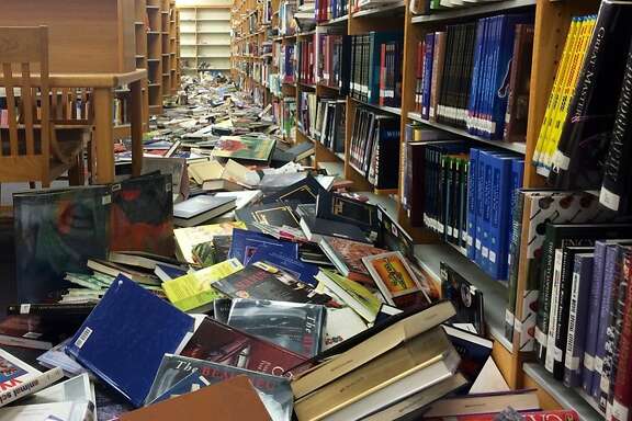 Books were scattered on the floor at Napa High School after Sunday's earthquake left schools in the Napa Valley Unified School District in various states of disarray. School was canceled for students Monday.