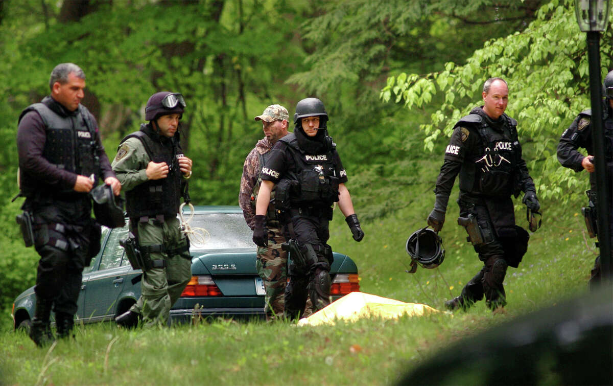 Police at the home on Dogwood Drive, in Easton, Conn. where Gonzalo Guizan was shot and killed by police during a raid on May 18th, 2008.