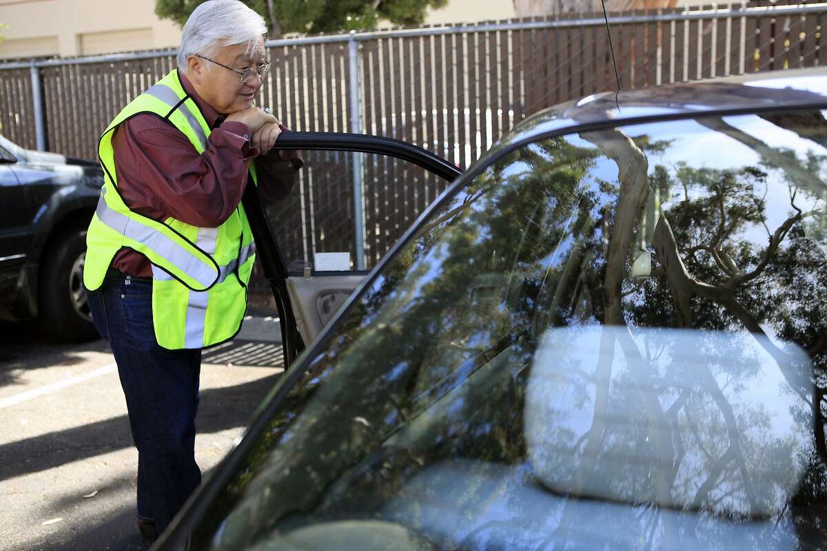 Rep. Mike Honda chats with a person in their car as they leave the Sunnyvale Community Services building in Sunnyvale, CA, Thursday, August 14, 2014.