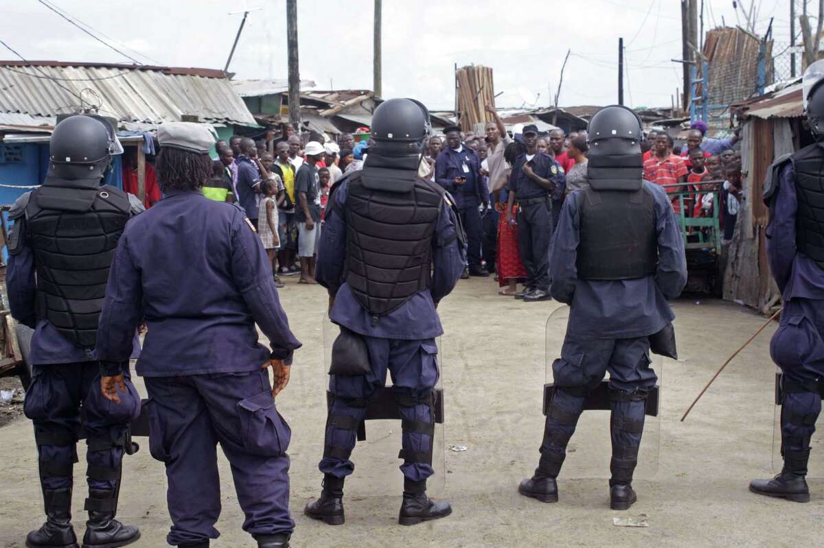 Liberian security forces in riot gear stop people Monday from leaving the West Point area that has been hit hardestby the Ebola virus spreading in Monrovia. A Liberian doctor who was among three Africans to receive an experimental Ebola drug has died, the country's information minister said Monday.