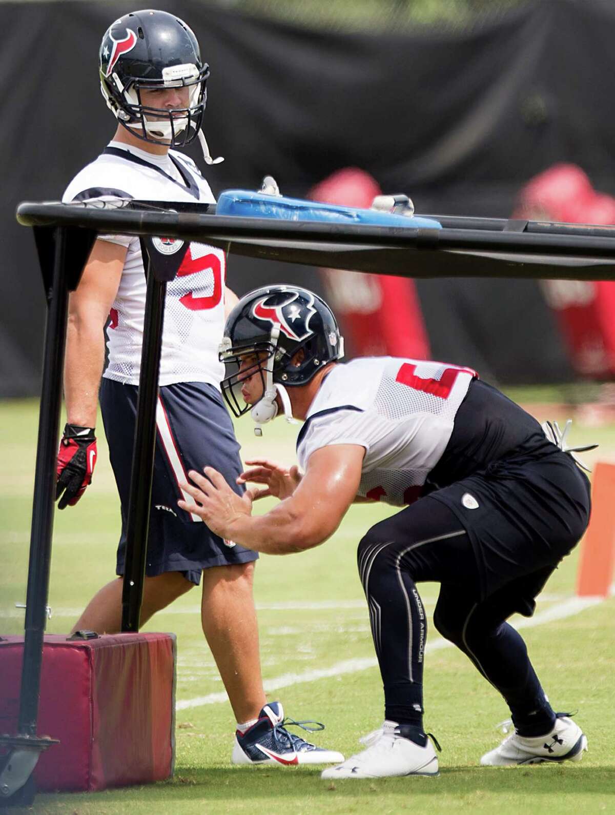 ﻿Brian Cushing, right, and﻿ fellow linebacker Jeff Tarpinian ﻿ were back at work with little time for the Texans to get ready for Thursday's preseason finale.