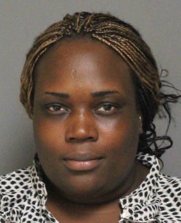 Couple accused of stealing liquor with child in tow