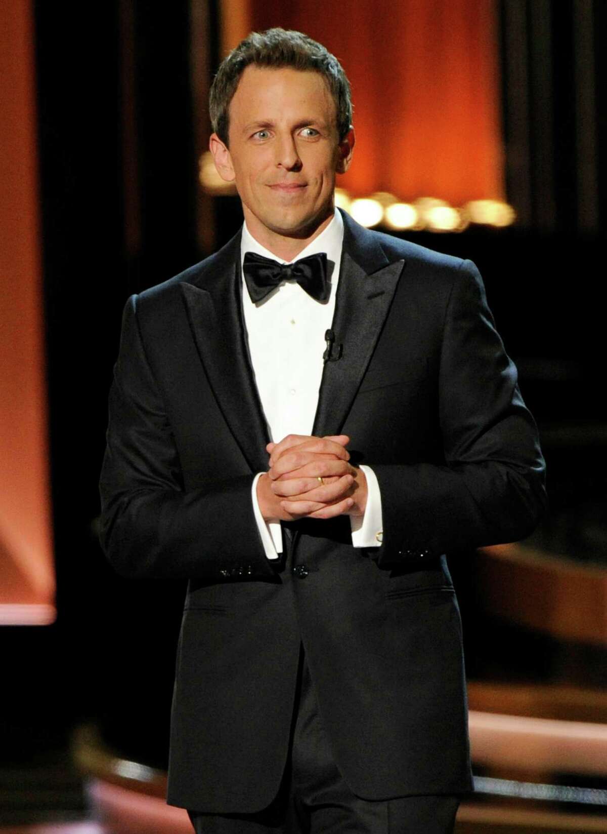 Host Seth Meyers speaks on stage at the 66th Annual Primetime Emmy Awards at the Nokia Theatre L.A. Live on Monday, Aug. 25, 2014, in Los Angeles. (Photo by Chris Pizzello/Invision/AP)