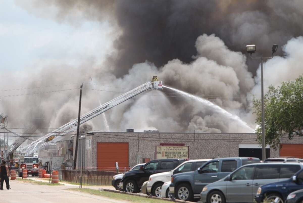 Flames race through South Houston warehouse