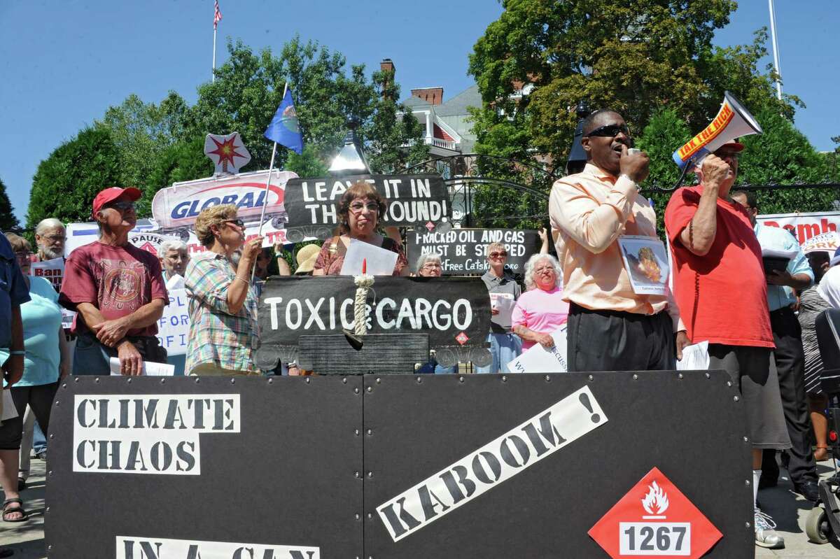 Willie White, Executive Director of AVillage, speaks using a megaphone as oil train opponents rally in front of the Governor's Mansion on Tuesday, Aug. 26, 2014 in Albany, N.Y. (Lori Van Buren / Times Union)