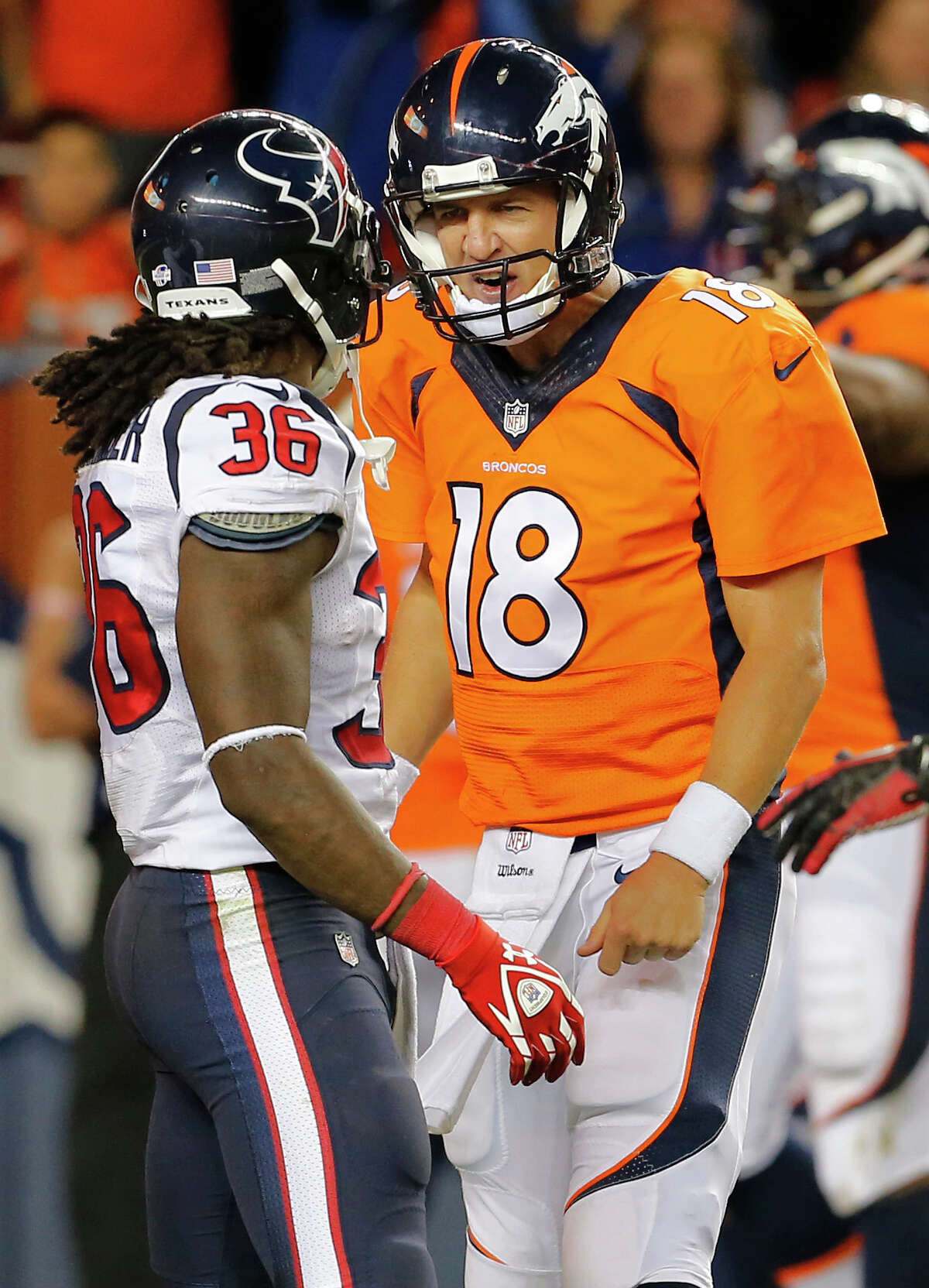 Safety D.J. Swearinger (36) is popular among Texans fans, but he didn't make any friends in Denver with a hit that left Broncos receiver Wes Welker (83) with a concussion. Peyton Manning (18, below) went so far as to voice his displeasure with Swearinger.