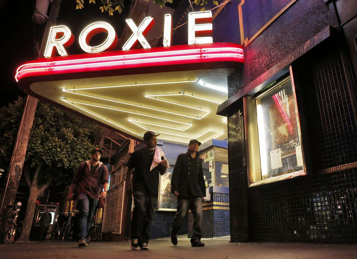 People walk by the Roxie Theater in San Francisco, Calif., on Tuesday, August 26, 2014. The Roxie is on theater that is fighting the battle for small independent theaters to stay alive. Situated in the Mission, it's a non profit screening house that is getting by with grants, donations and picking obscure, but watchable films.