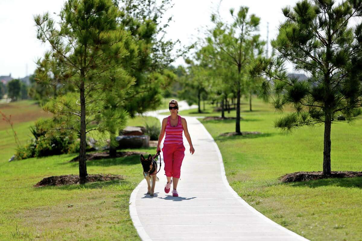 A dry detention area at the corner of Far Hills Dr. and Ranch Point Dr. in Cinco Ranch, which are landscaped with greenbelt trails, trees, shrubs and some water to turn them into recreational and scenic amenities for the community, Wednesday, Aug. 27, 2014, in Katy, Texas. ( Gary Coronado / Houston Chronicle )