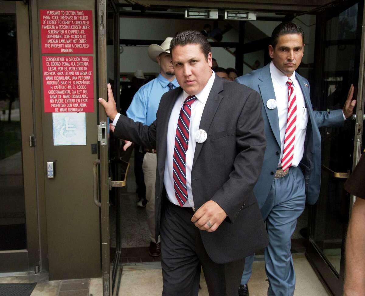 David Barajas and defense attorney Sam Cammack III, right, exit the Brazoria County courthouse Wednesday after the trial.