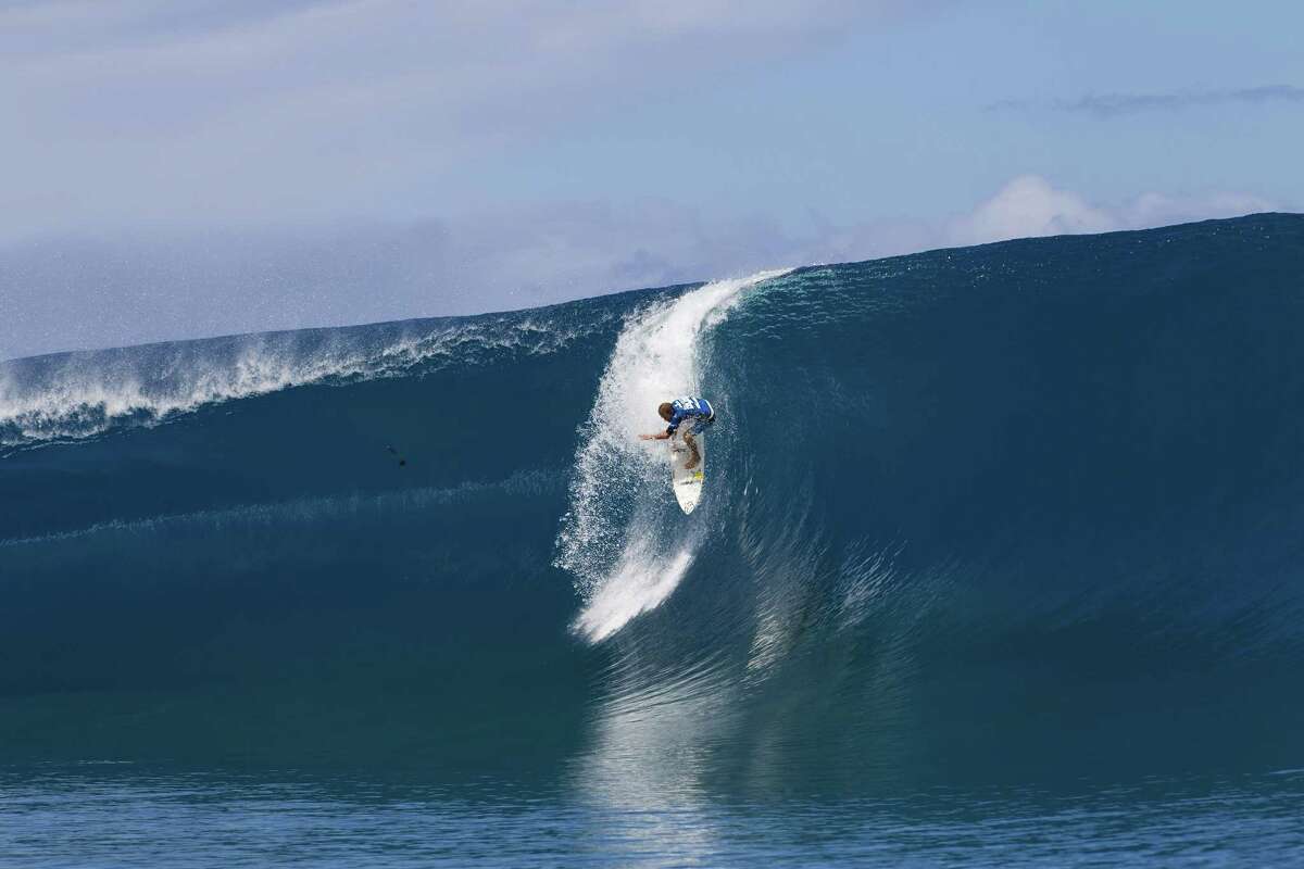 Bede Durbidge of Australia drops into a wave at the Billabong Pro Tahiti on August 25, 2014 in Teahupo'o, French Polynesia.