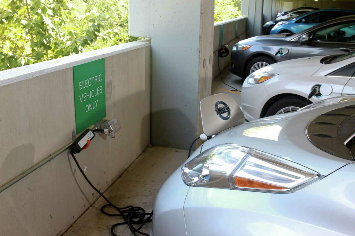 Electric cars in reserved parking spaces used for charging electric cars at BP's Westlake campus in West Houston (For the Chronicle/Gary Fountain, August 27, 2014)