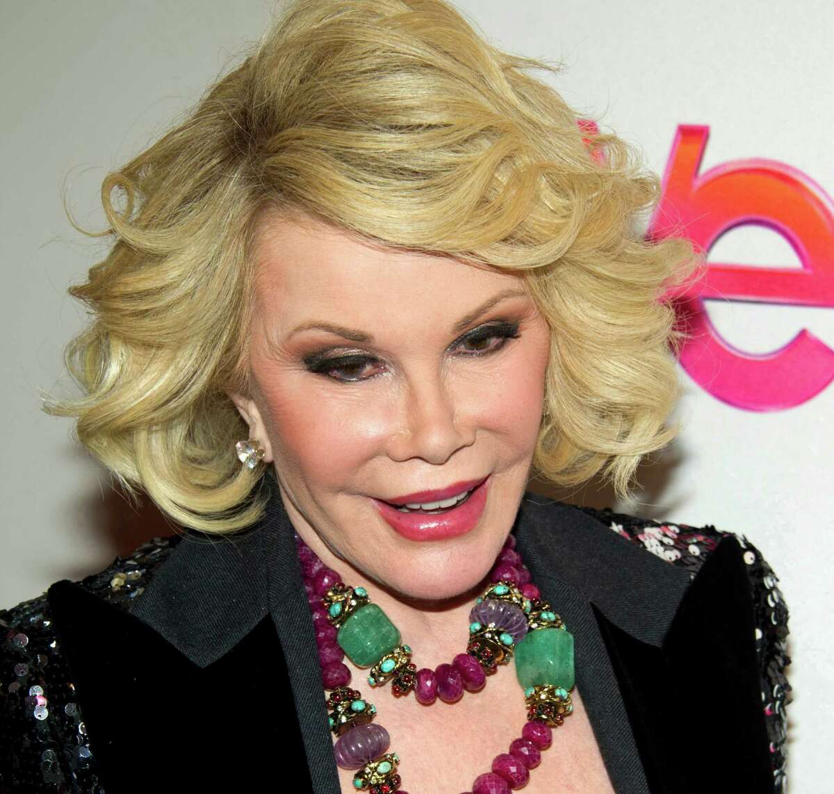 FILE - In this Jan. 19, 2012, file photo, Joan Rivers attends a screening of the Season 2 premiere of WE TV's "Joan & Melissa: Joan Knows Best?" in New York. Two police officials say Rivers has been rushed in cardiac arrest from a doctorâs office to a New York City hospital, Thursday, Aug. 28, 2014. (AP Photo/Charles Sykes, File)