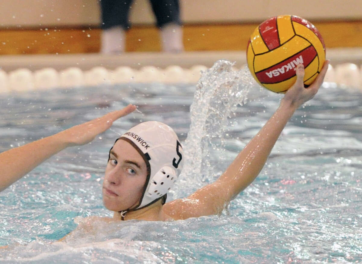 Alex Prout (# 5) of Brunswick School passes during match against Gonzaga College High School in the 39th Annual Cardinal Water Polo Tournament at Greenwich High School, Saturday, Oct. 19, 2013.