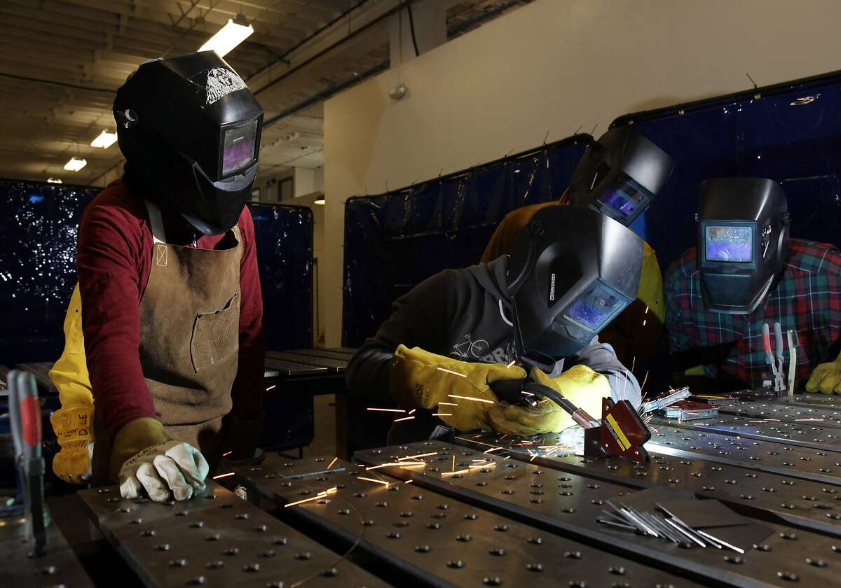 Welding instructor Rebecca Chapman, left, watches as her student Esther Cervantes practices a weld during a class at the TechShop in San Francisco, Calif., on Monday, February 7, 2011. The TechShop is a cross between High School shop class and high tech factory. Membership in the workshop allows access to light and heavy machinery and tools. Members, range from hobbyists to entrepreneurs, creating everything from t-shirts to light fixtures, to prototypes to motorcycles.