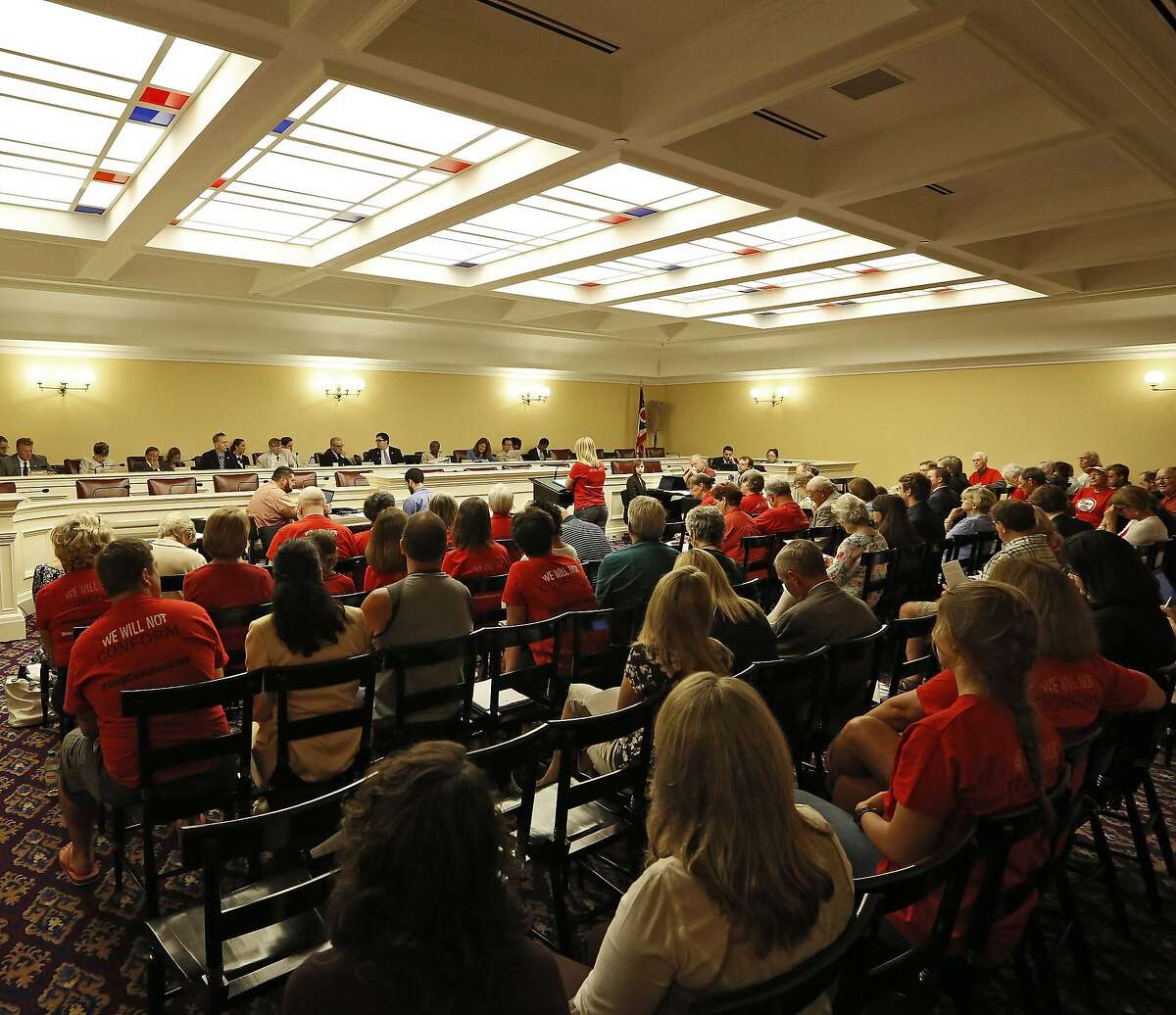 ADVANCE FOR SUNDAY, AUG. 31 AND THEREAFTER - This photo taken Monday, Aug. 18, 2014 shows hearings on legislation to repeal Common Core academic standards in the House Finance Hearing Room at Ohio Statehouse in Columbus, Ohio. Millions of students will sit down at computers this year to take new tests rooted in the Common Core standards for math and reading, but policymakers in many states are having buyer's remorse. The fight to repeal the standards has heated up in Ohio, where Republican legislators such as state Rep. Andy Thompson saying it's kind of “creepy the way this whole thing landed in Ohio with all the things prepackaged.” (AP Photo/Columbus Dispatch, Kyle Robertson)