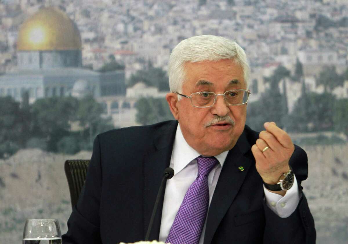 FILE - In this file photo taken Tuesday, April 29, 2014, Palestinian President Mahmoud Abbas speaks during a meeting with Palestinian businessmen from East Jerusalem to set up a national fund to support the Palestinian residents of East Jerusalem, at his office in the West Bank city of Ramallah. Abbas has accused Hamas of needlessly extending fighting in the Gaza Strip, causing a high death toll. He told Palestine TV in remarks broadcast Friday, Aug. 29, that "it was possible for us to avoid all of that, 2,000 martyrs, 10,000 injured, 50,000 houses (damaged or destroyed)." (AP Photo/Nasser Shiyoukhi, File)