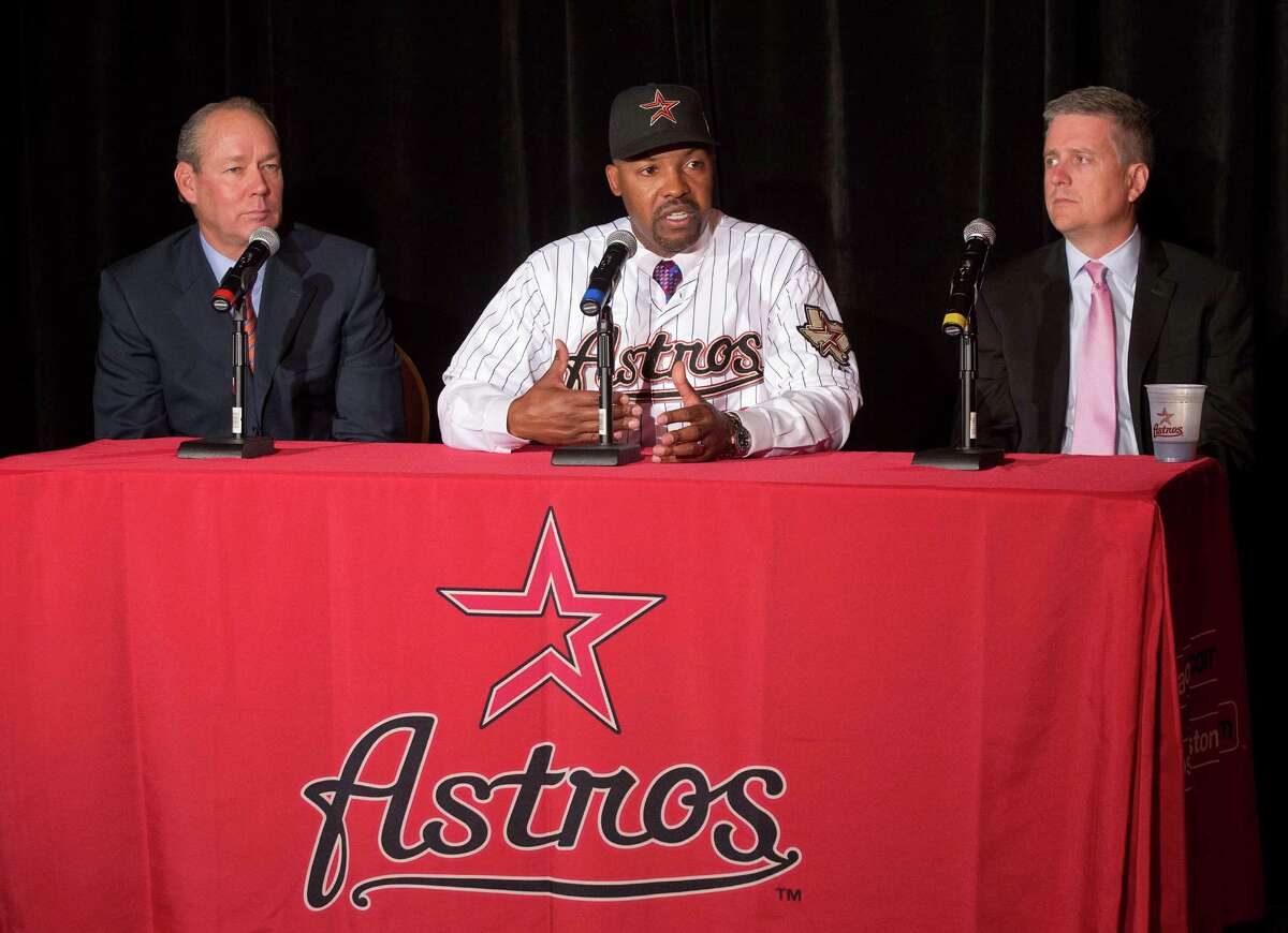 Back in possibly happier times, newly hired manager Bo Porter is sandwiched between Astros owner Jim Crane, left, and general manager Jeff Luhnow. Porter denied Friday he has talked to Crane about reported troubles with Luhnow.