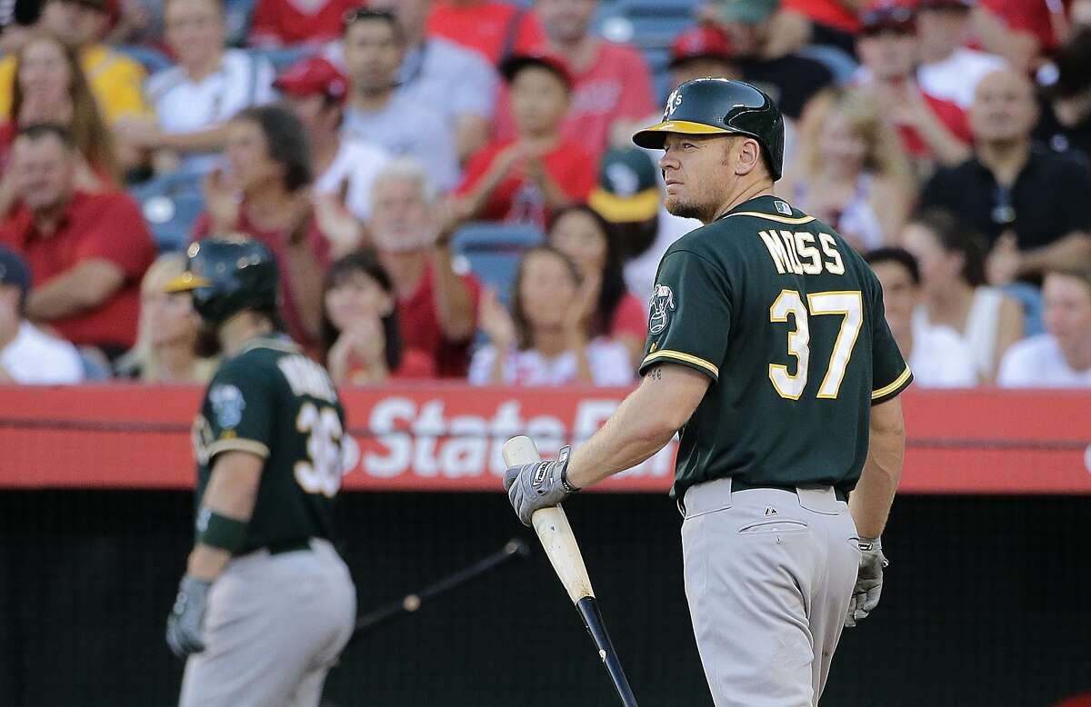 Oakland Athletics' Brandon Moss (37) walks off the field after striking out during the first inning of a baseball game against the Los Angeles Angels, Saturday, Aug. 30, 2014, in Anaheim, Calif. (AP Photo/Jae C. Hong)