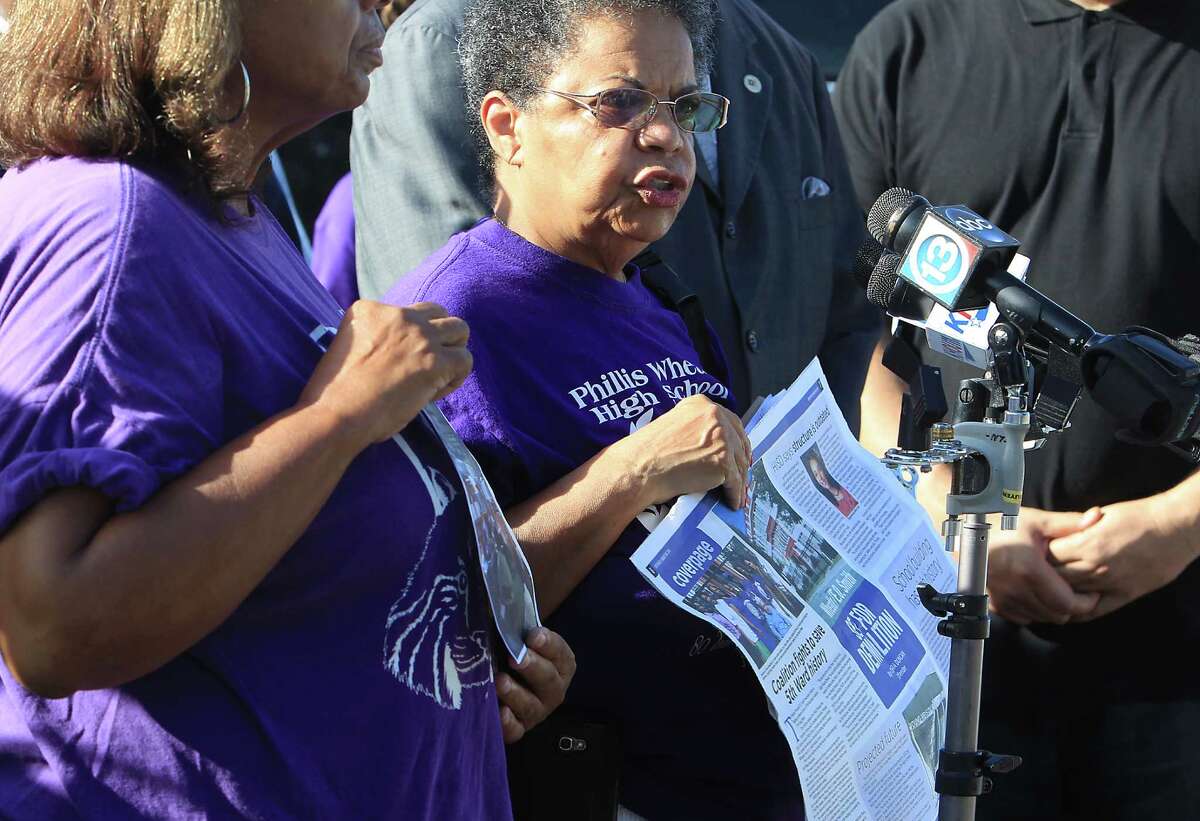 Ida Powell speaks along with community leaders during a protest rally on the demolition of the historic Wheatley / E. O. Smith school in the Fifth Ward Monday, Sept. 1, 2014, in Houston.