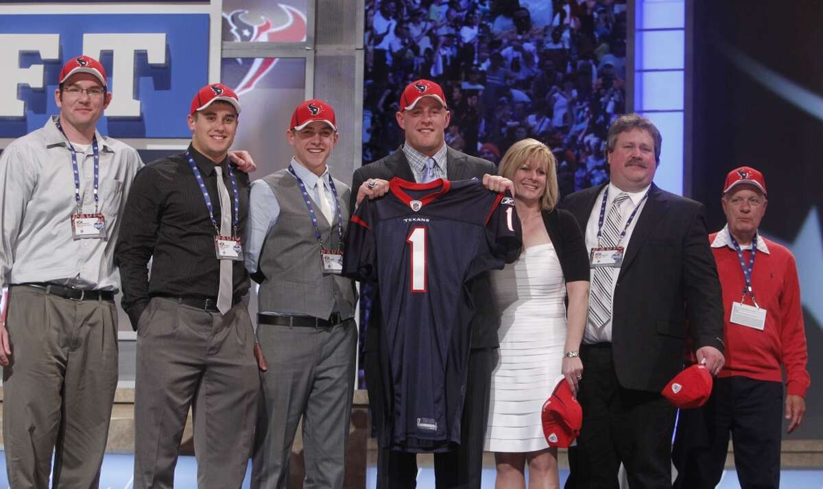 2011 Wisconsin defensive end J.J. Watt poses for photographs with guests after he was selected as the 11th overall pick by the Houston Texans in the first round of the NFL football draft at Radio City Music Hall on Thursday, April 28, 2011, in New York. (AP Photo/Jason DeCrow)