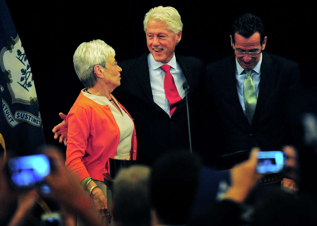 Former President Bill Clinton, center, stands with Lt. Gov. Nancy Wyman, left, and Gov. Dannel P. Malloy, during a campaign visit in support of the governor's re-election at the Omini Hotel in New Haven, Conn. on Tuesday, September 2, 2014.