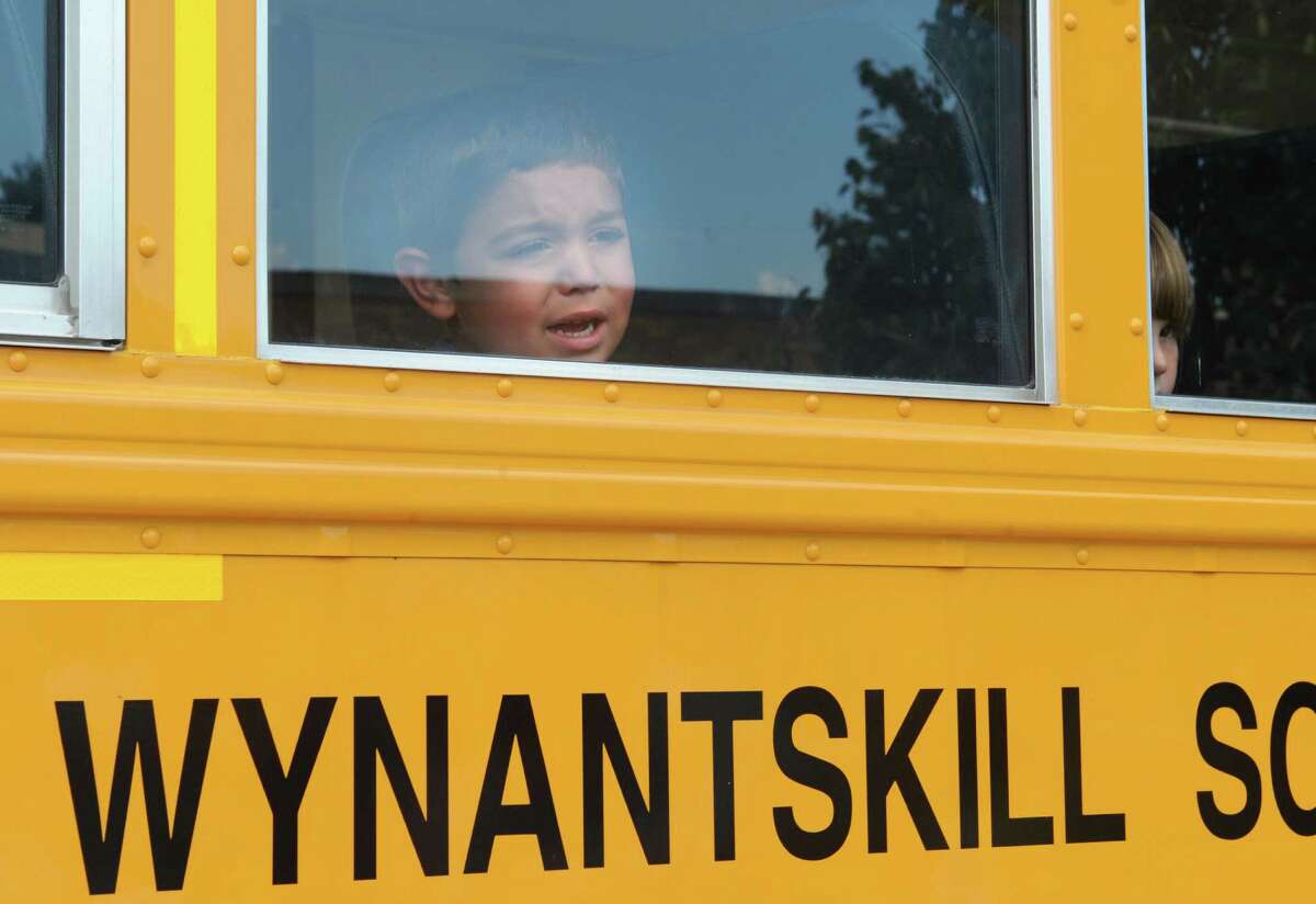 Anthony Vazzana, 4, of Wynantskill looks out the window at his mom and cries a little as kindergarten students take a test ride on a school bus at Gardner-Dickinson School on Tuesday, Sept. 2, 2014 in North Greenbush, N.Y. Parents brought their kindergarten students to drop off school supplies, meet their teachers and take a quick bus ride. (Lori Van Buren / Times Union)