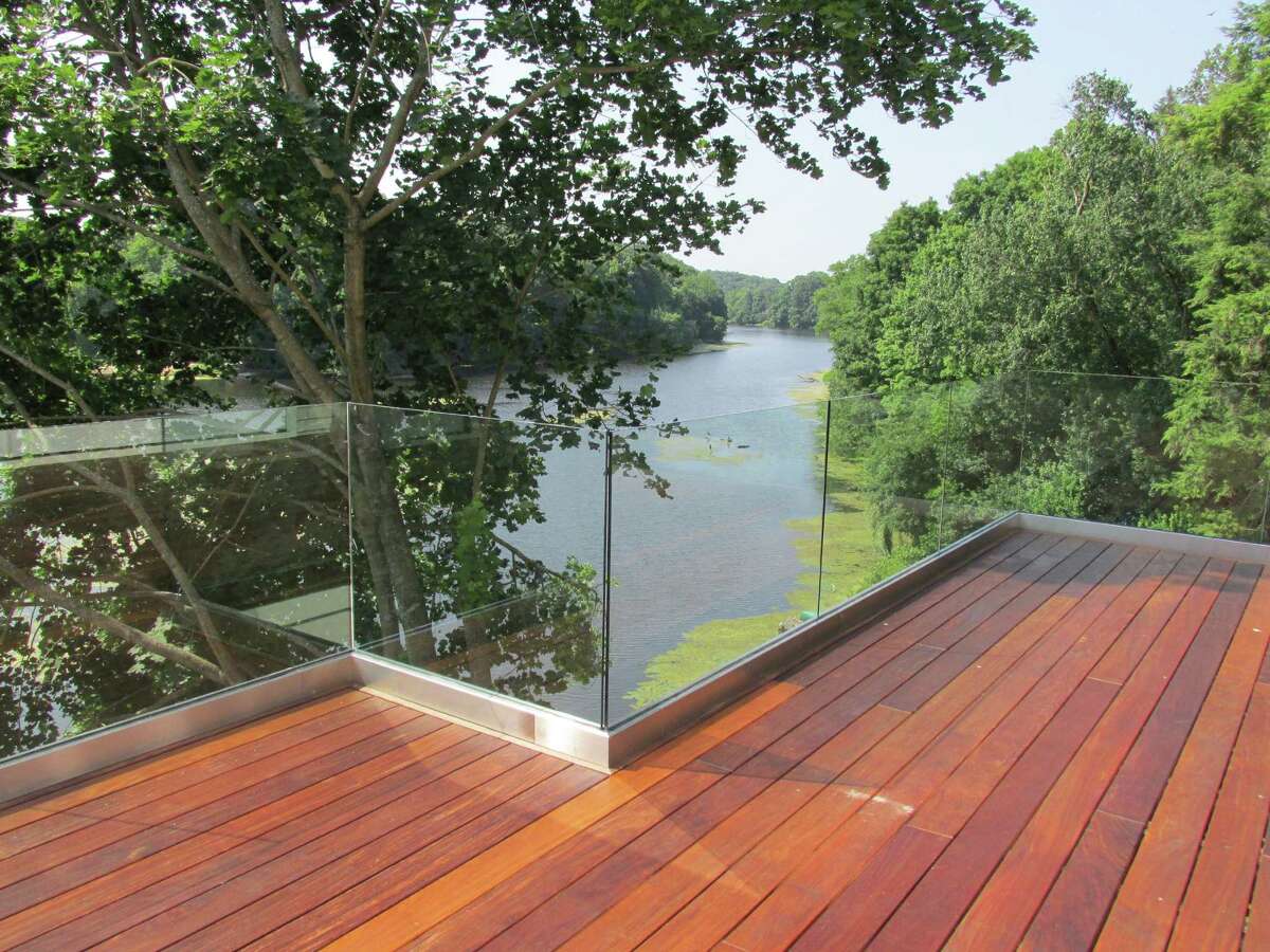 The first floor deck with unique glass railing at 265 Valley Road in Greenwich, which was built by Cos Cob contractor Tim Muldoon. It's on the market for $2.995 million
