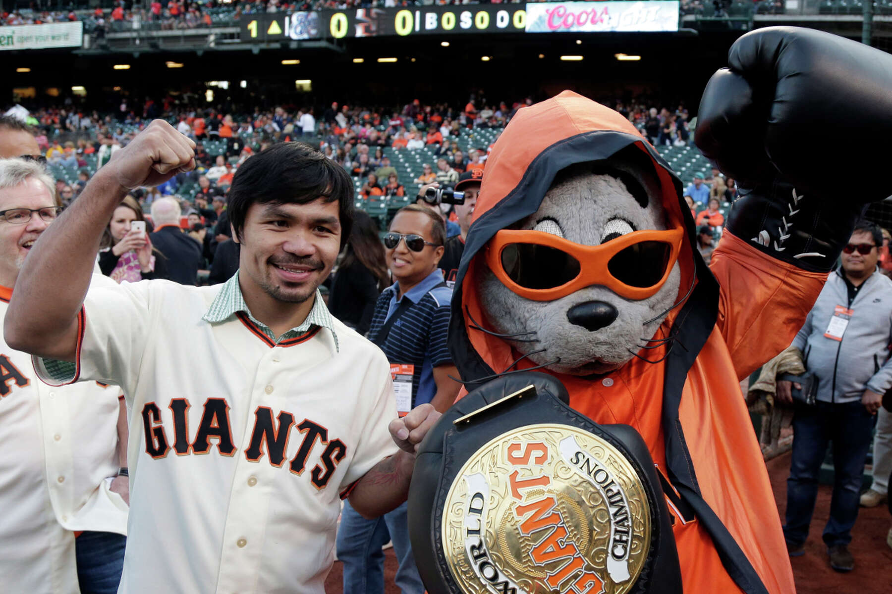 San Francisco, CA: San Francisco Giants mascot Lou Seal gives out