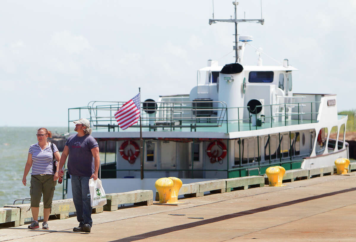 Pamela Wiswell, left, walks with her husband and Army veteran Kenneth Wiswell, right, as they look at different vessels during a job fair hosted by The American Maritime Partnership at the Bayport Cruise Terminal, Wednesday, Sept. 3, 2014, in Pasadena. The fair is designed for ex-military to interview for maritime jobs. (Cody Duty / Houston Chronicle)