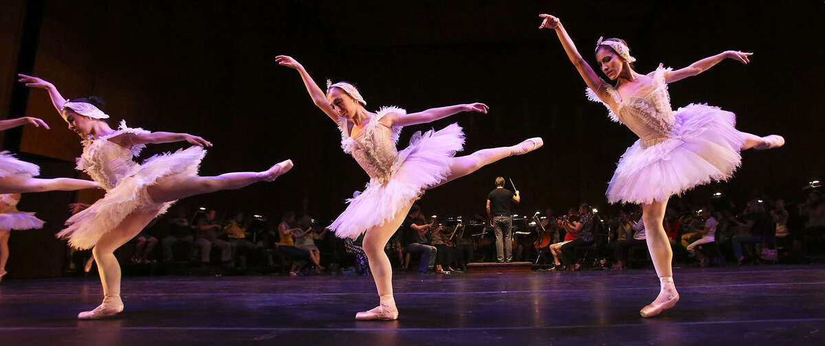 Members of Ballet San Antonio (above) and the San Antonio Symphony (left) rehearse for tonight's inaugural performance at the Tobin Center for the Performing Arts.