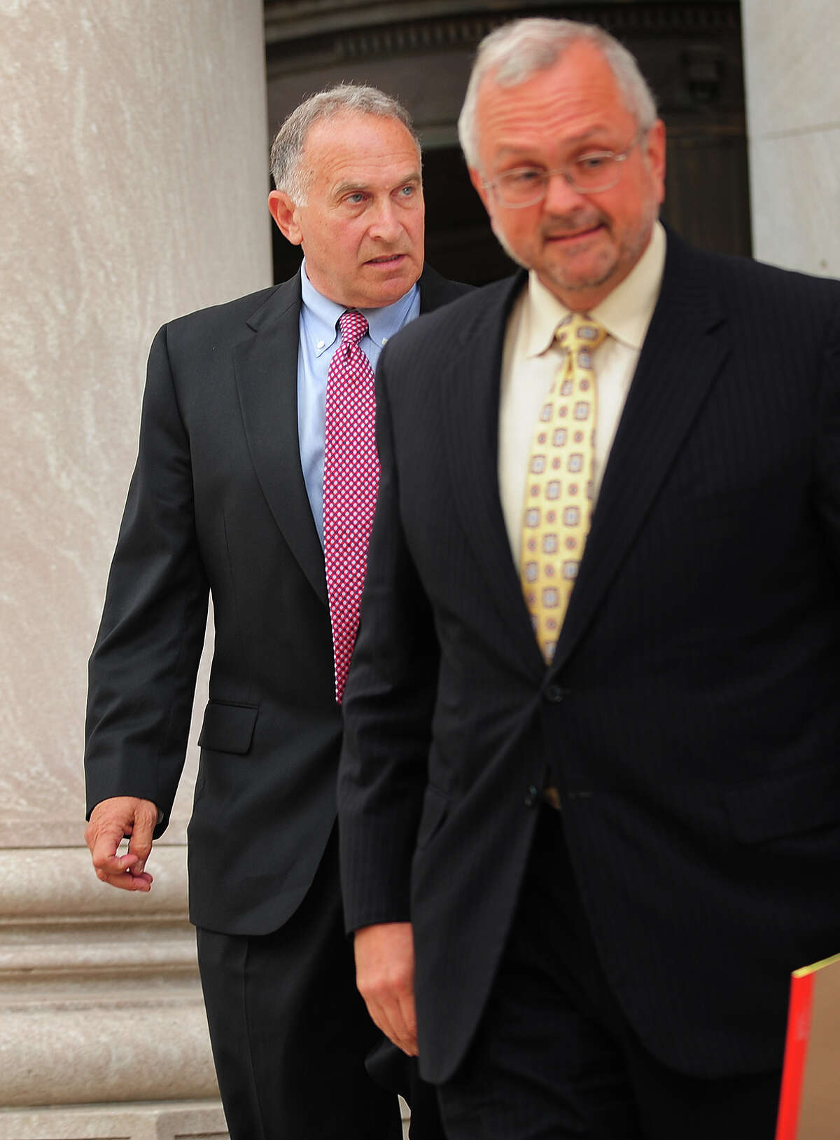 Mark Greenberg, left, witness in the trial of former Governor John Rowland, exits federal court in New Haven, Conn. on Wednesday, September 3, 2014. Rowland is on trial on seven charges including conspiracy and obstruction of justice.