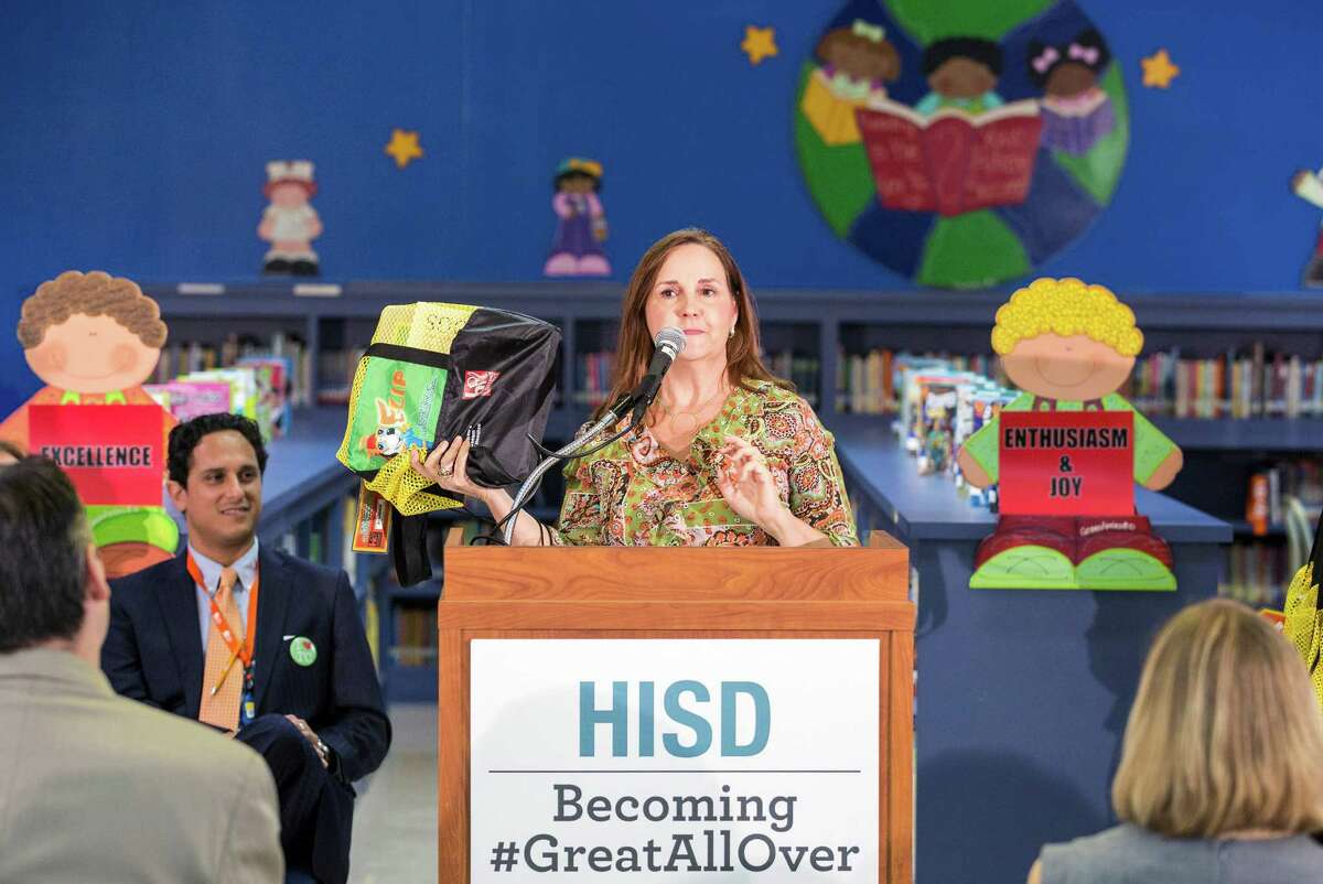 Cindy Puryear, the district's director of literacy, leads Thursday's news conference at Garcia Elementary announcing "Read Houston Read," a program to pair 1,500 volunteers with students for weekly readings.