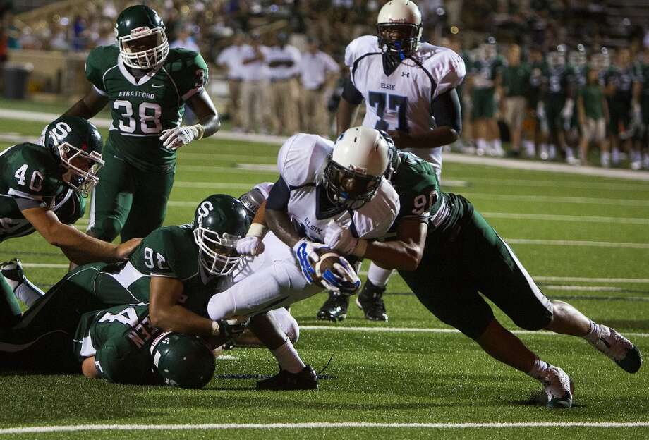 stratford high school defenders wrap up elsik high schools e.j.