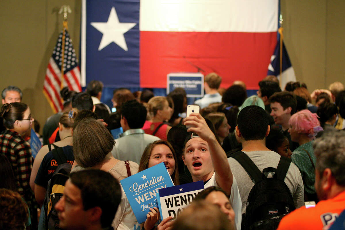 Supporters of Democratic gubernatorial candidate Fort Worth Sen. Wendy Davis take a selfie Sept. 4, 2014 before Davis took the stage to address a crowd of about 200 at the University of Texas at San Antonio H-E-B University Center.