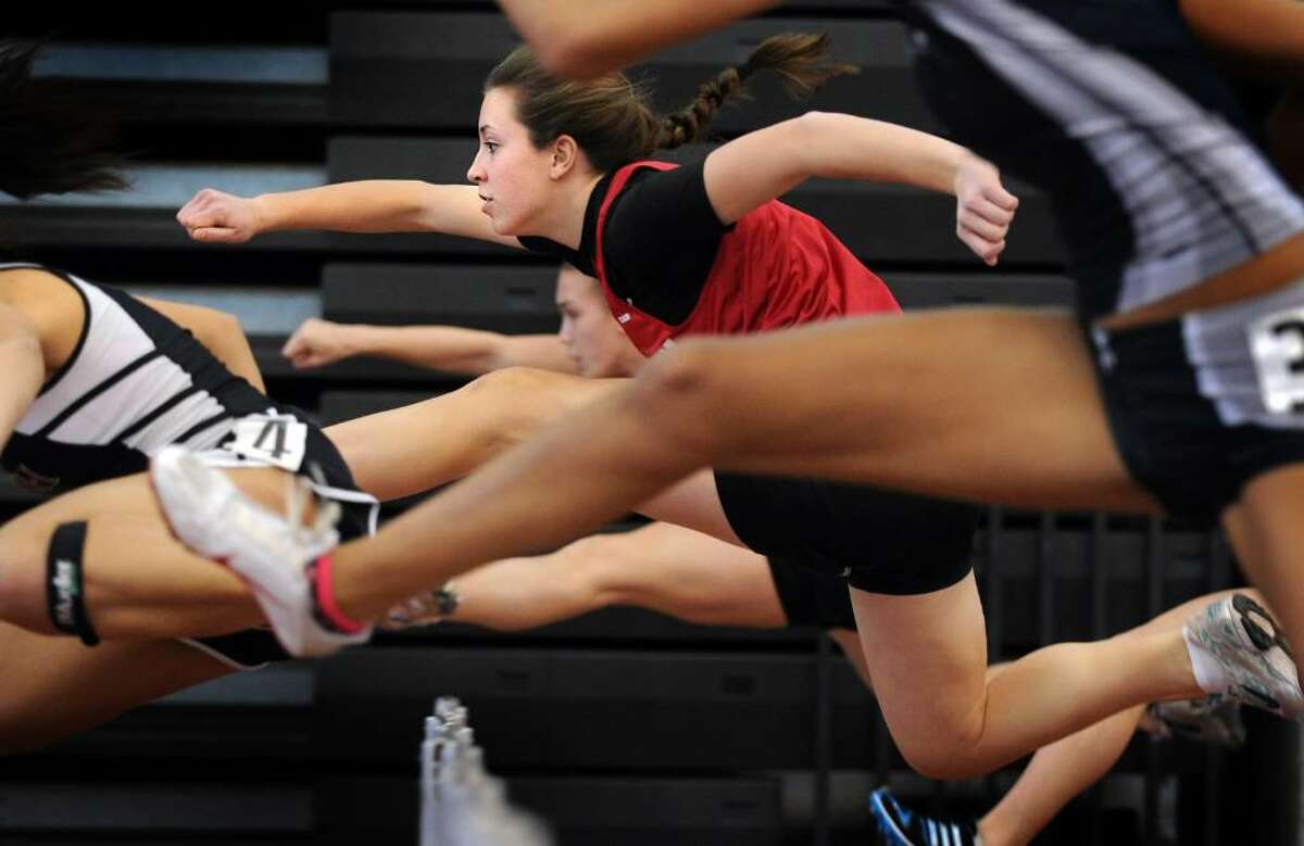 Masuk's Amanda Snajder competes in the 55 Meter Hurdles Saturday Feb. 20, 2010 at the CIAC State Championship Indoor Track and Field meet at the New Haven Athletic Center.