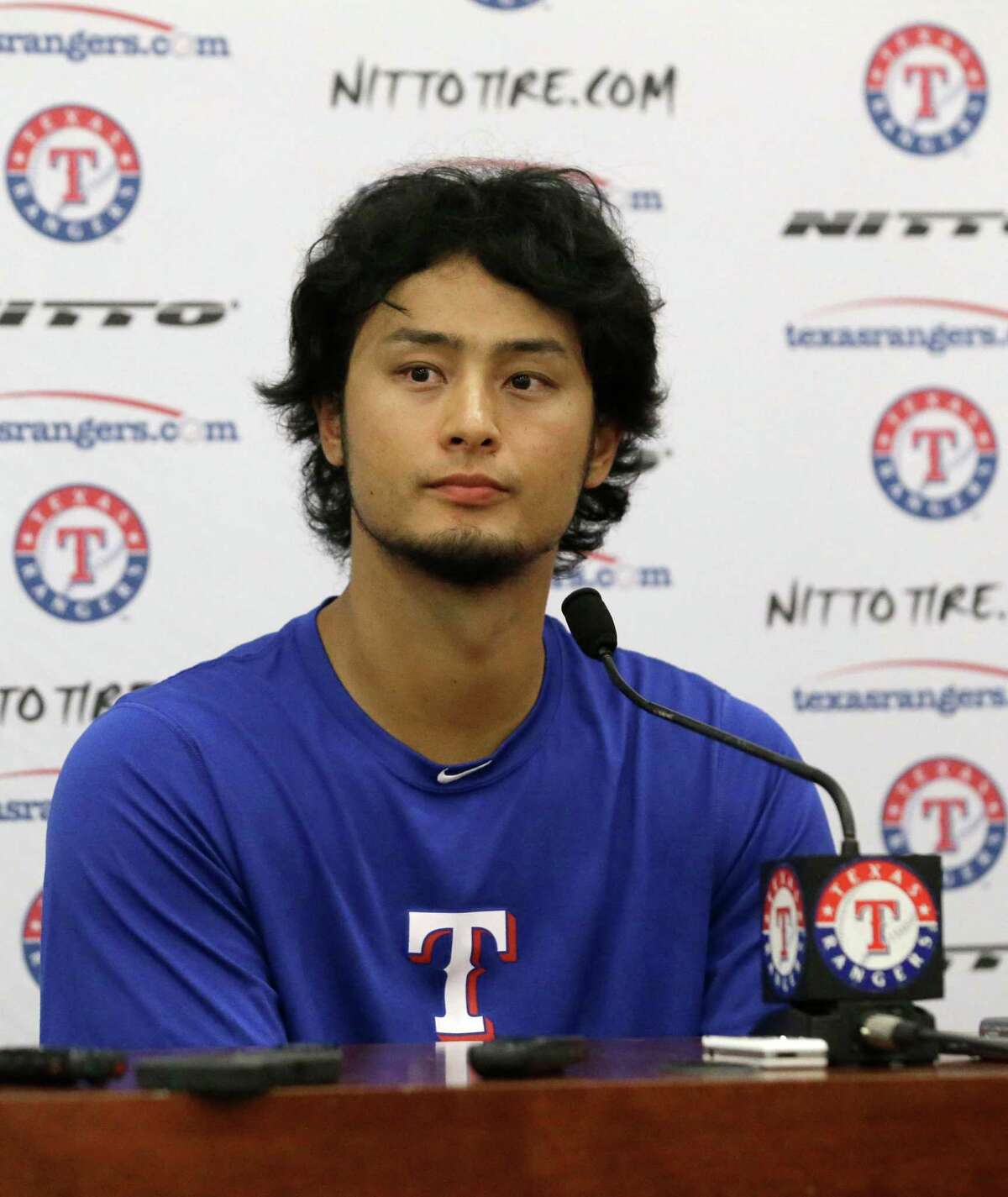 Texas Rangers right handed pitcher Yu Darvish of Japan listens to a question during a news conference Saturday, Sept. 6, 2014, in Arlington, Texas. (AP Photo/LM Otero)