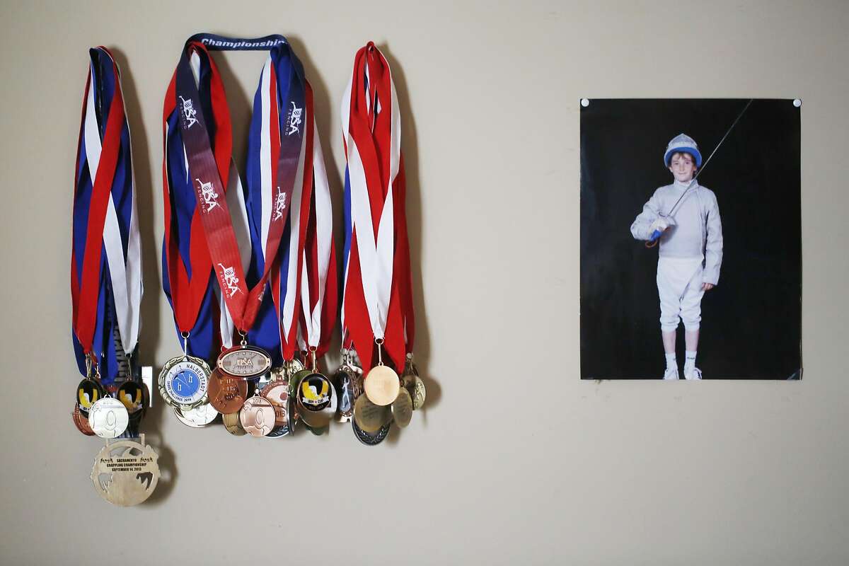 A hefty collection of medals and awards decorate the wall in Ethan Mullennix's room in San Francisco, Calif.