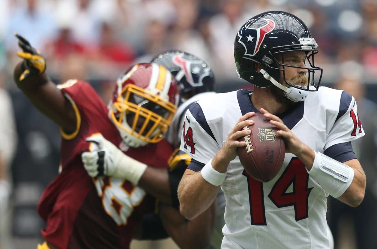 Houston Texans quarterback Ryan Fitzpatrick (14) looks for a receiver under pressure from Washington Redskins outside linebacker Brian Orakpo (98) during the first quarter of an NFL football game at NRG Stadium on Sunday, Sept. 7, 2014, in Houston. ( Brett Coomer / Houston Chronicle )