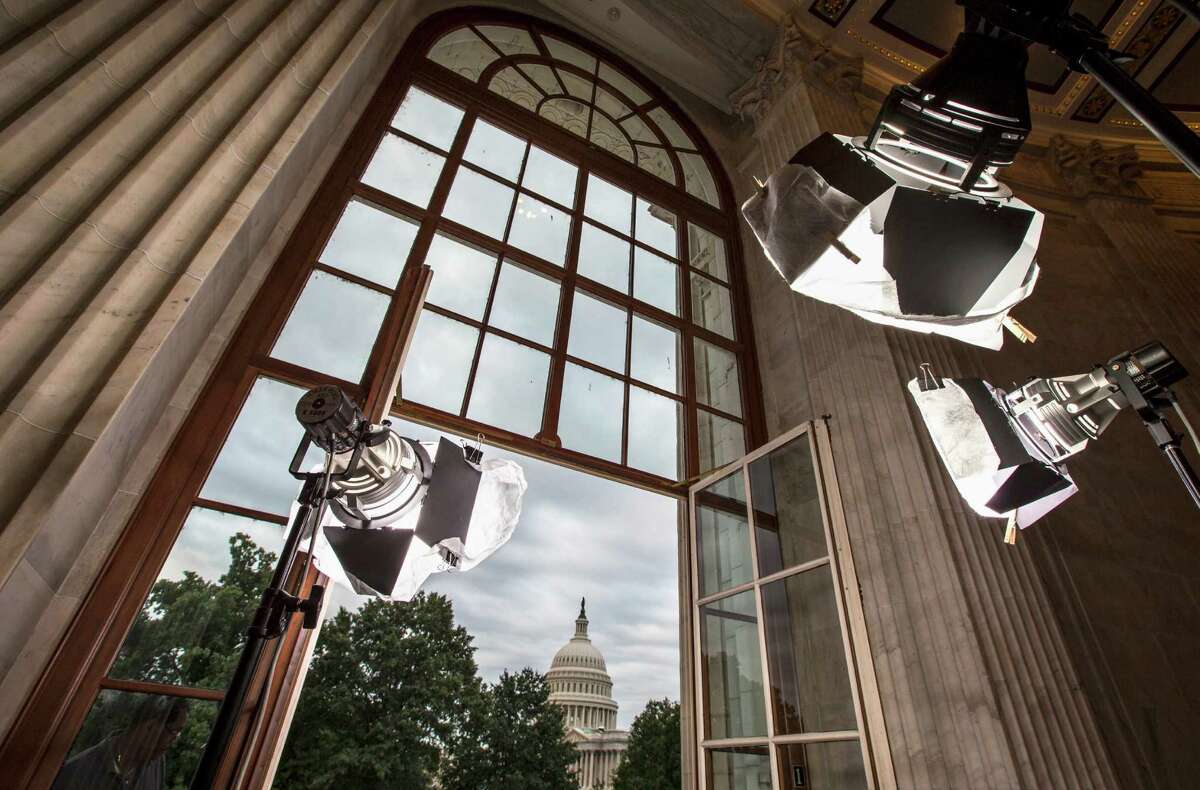 FILE - In this Sept. 9, 2013 file photo television news lights await the start of activity on Capitol Hill in Washington as both houses of Congress return to full legislative session. Lawmakers are streaming back to Capitol Hill after this year's summer vacation for an abbreviated September session in which feuding Democratic and Republican leaders promise action to prevent a government shutdown while holding votes aimed at defining the parties for the fall campaign. Republicans control the House and want to pad their 17-vote majority, so they intend to follow this simple rule: first, do no harm. (AP Photo/J. Scott Applewhite, File)