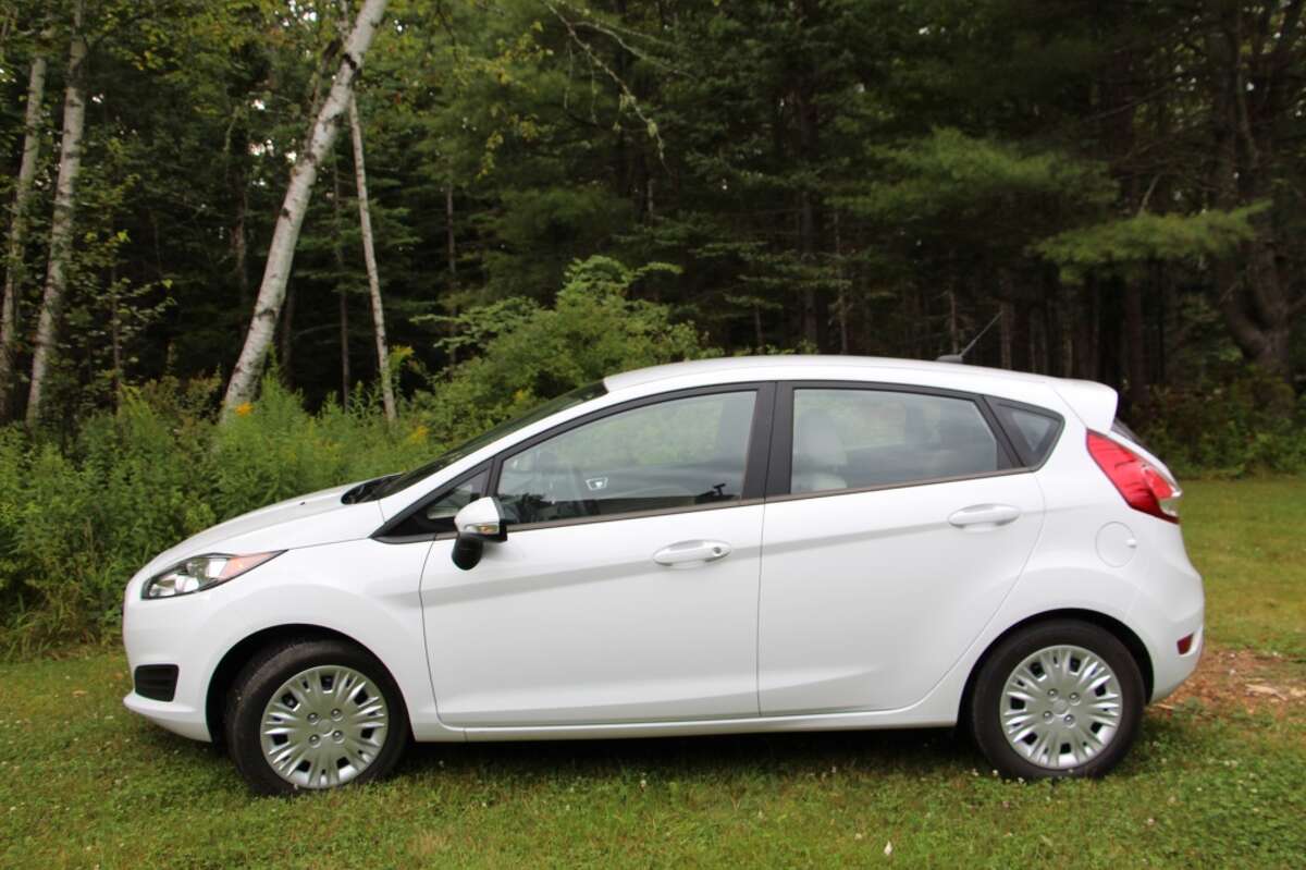 The 2014 Ford Fiesta is a jaunty, peppy, very small (less than 160 inches; under 2,600 pounds) hatchback that is designed to combine handling, space and fuel mileage in one economical package. The midsize range of cars – think Toyota Camry, Honda Accord, Ford Fusion – is the most popular segment, but the subcompacts are the starter cars for young people. (All photos by Michael Taylor)