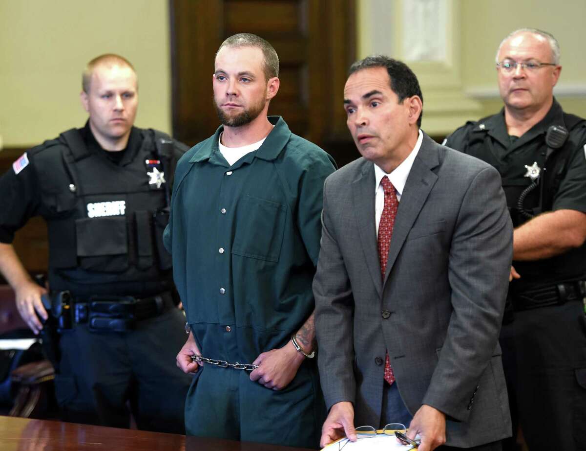 Daniel P. Reuter, left, stands with his attorney, Jay Hernandez, while his is arraigned on murder charges Monday morning, Sept. 8, 2014, in Rensselaer County Court in Troy, N.Y. (Skip Dickstein/Times Union)