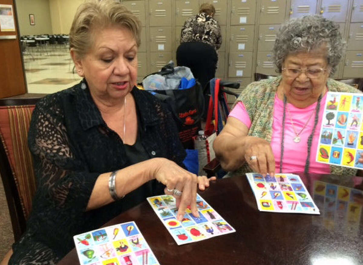 Rose Algueseva (left), 71, and Socorro Varela, 86, play loteria at the Alicia Treviño López Senior Center.