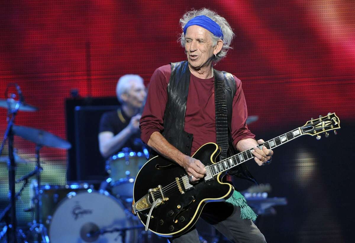 FILE - This May 3, 2013 file photo shows Keith Richards of the Rolling Stones performing at the kick-off of the band's "50 and Counting" tour in Los Angeles. Richards has a children's book “Gus & Me: The Story of My Granddad and My First Guitar," with illustrations by his daughter, Theodora, released on Sept. 9, 2014. (Photo by Chris Pizzello/Invision/AP, File)