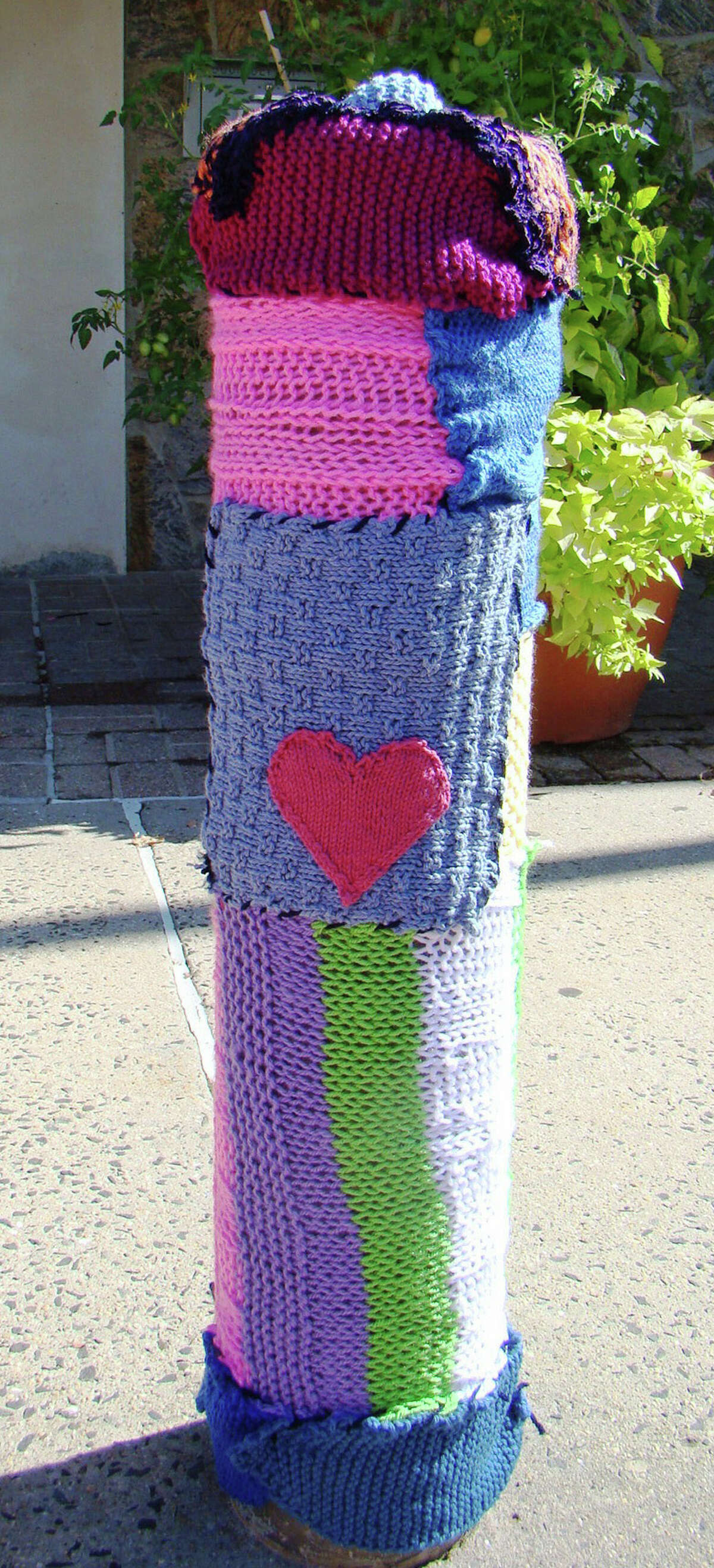 Ninja knitters 'yarn bomb' Fairfield Woods Library for coming celebrations